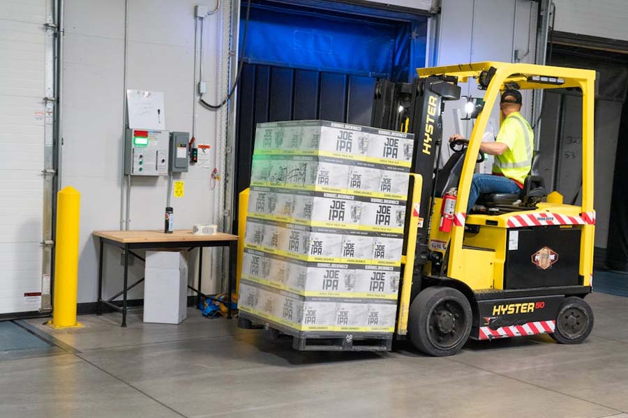 Warehouse worker on forklift