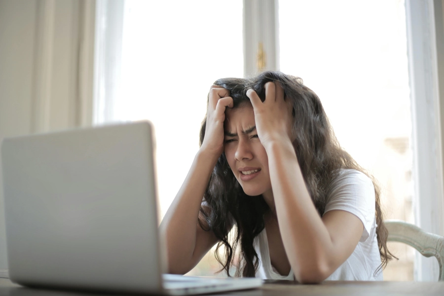 Upset person with laptop